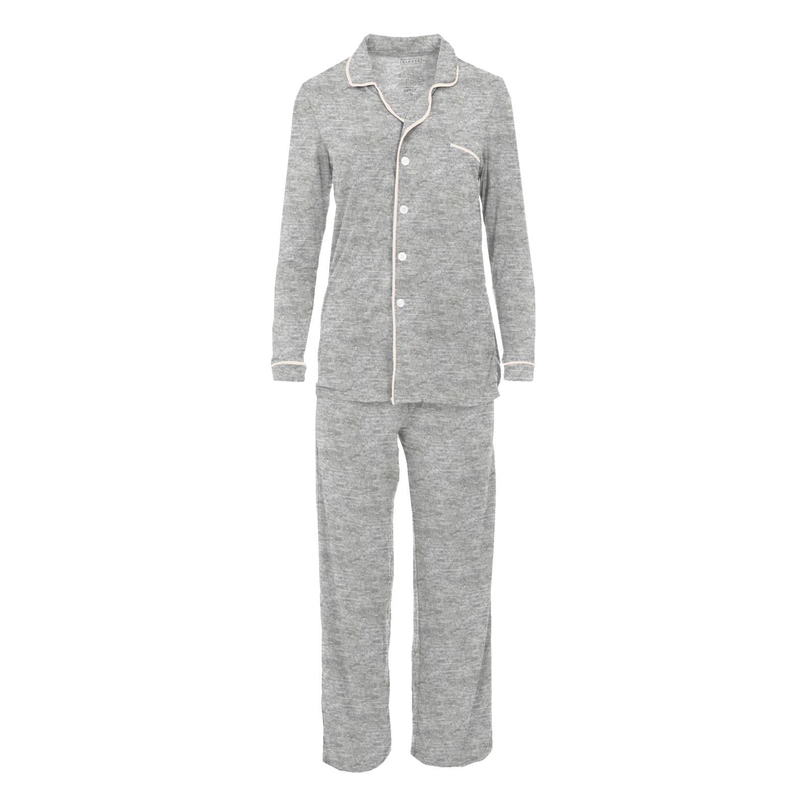 A woman wearing a soft heathered mist grey long-sleeved collared button-up pajama set with relaxed fit pants.