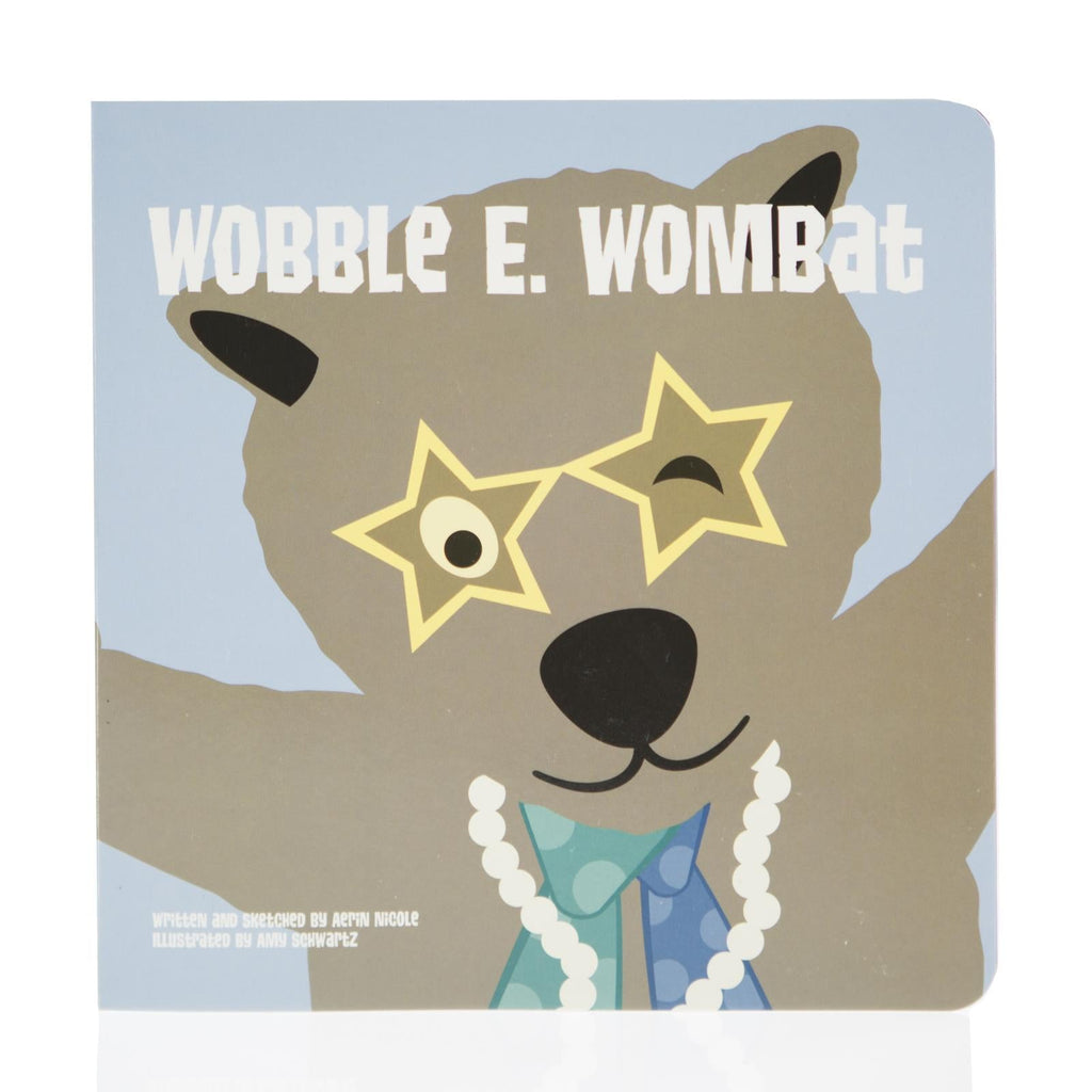 A square board book titled Wobble E. Wombat featuring a cute brown wombat wearing star-shaped glasses and a pearl necklace.
