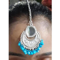 Blue drops maang tikka with oxidized silver finish and central mirror design