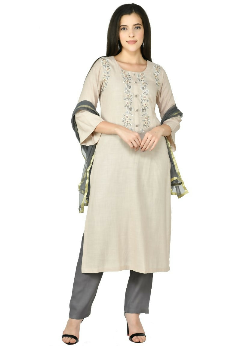 Woman wearing a stylish 3-piece beige cotton rayon kurta set with matching dupatta