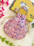 A stylish pink synthetic potli bag featuring a compact 9x9 inch design for ethnic occasions