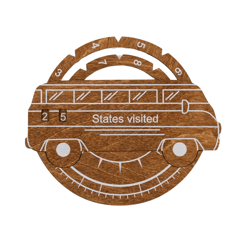 3D wooden USA map travel tracker in oak finish featuring white engraved state details on a circular wood panel.