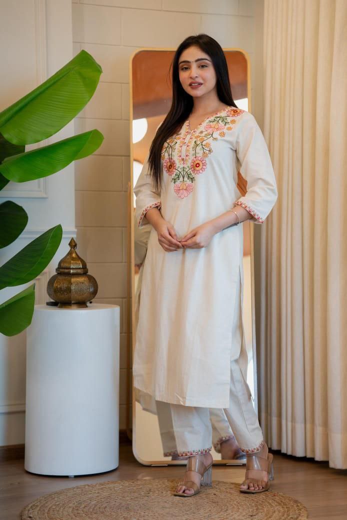 Off-white pure Khadi cotton kurta pant set with floral embroidery and sequence work details.