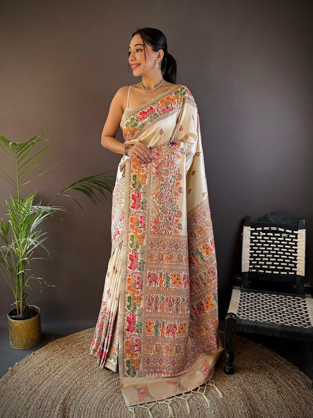 Elegant white Meena Weaves soft silk saree with traditional detailed borders.