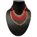 Detailed view of a red and gold threaded necklace featuring traditional craftsmanship