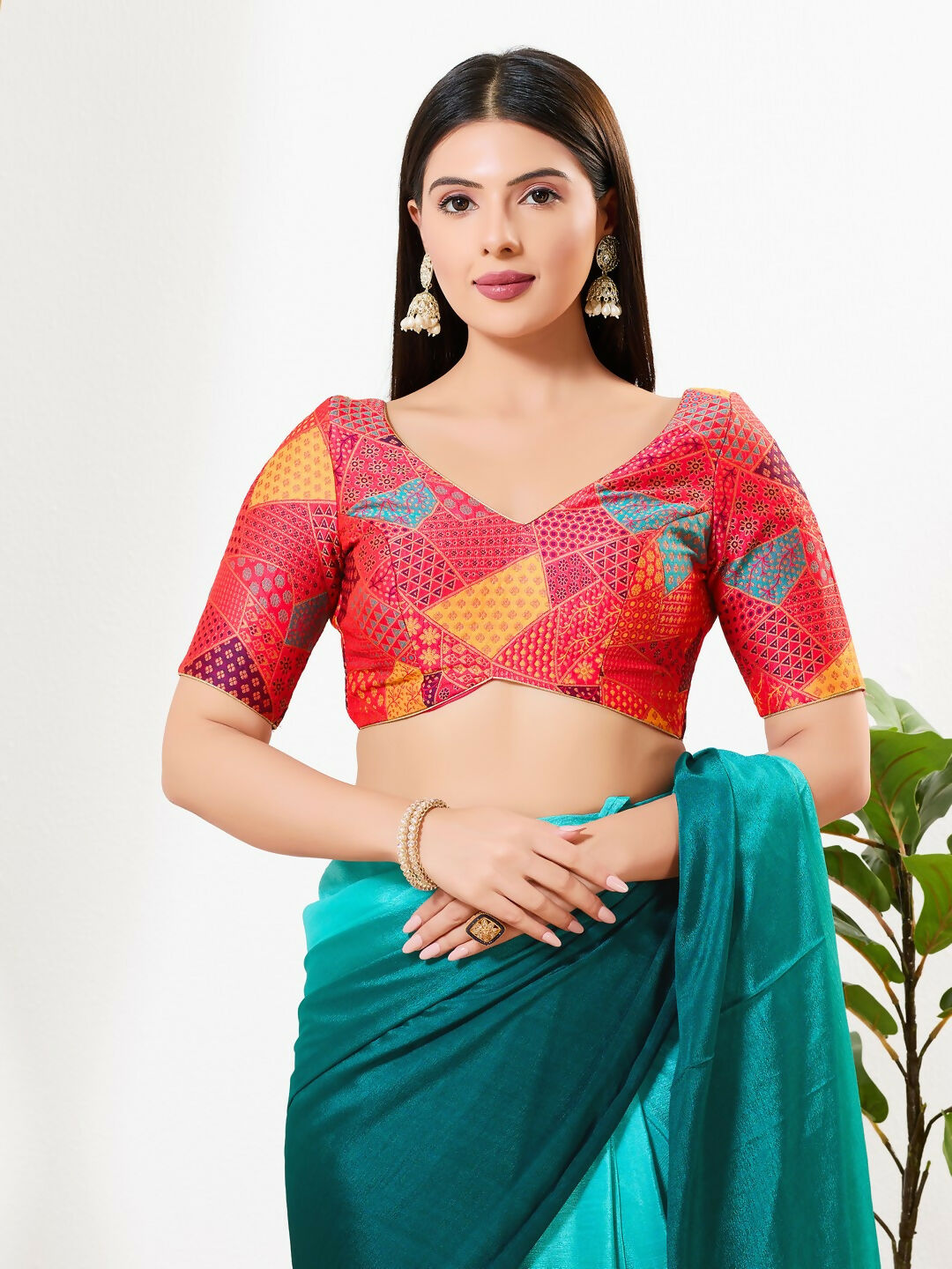 Red brocade padded blouse with V-neckline and elbow sleeves