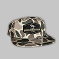 Black hat with hex pattern patch and olive rope detailing viewed from the front