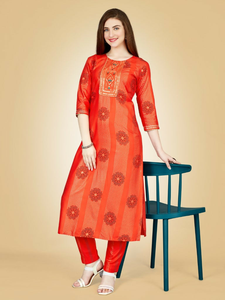 Women wearing a bright orange embroidered viscose rayon straight kurta pant set