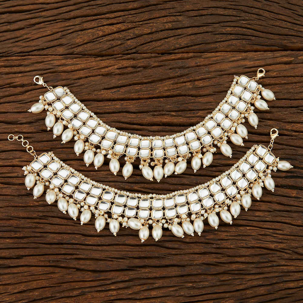 Dista Golden White Kundan Payal Anklets featuring Jadau Kundan and pearls