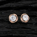 A pair of elegant golden brass earrings featuring white AD stones for women