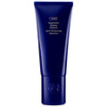 Oribe Supershine Hydrating Conditioner in a deep navy blue tube with gold foil lettering.