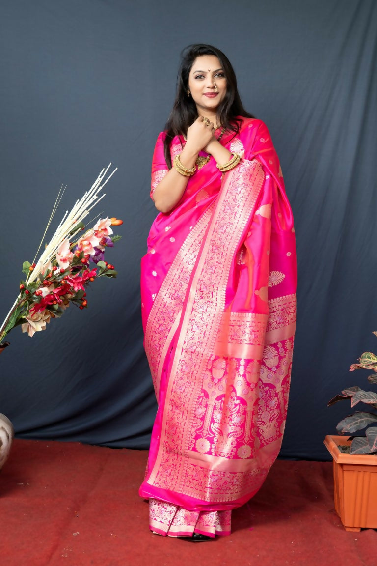 Pink Paithani silk saree with intricate gold Zari woven patterns and matching blouse.