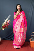 Pink Paithani silk saree with intricate gold Zari woven patterns and matching blouse.