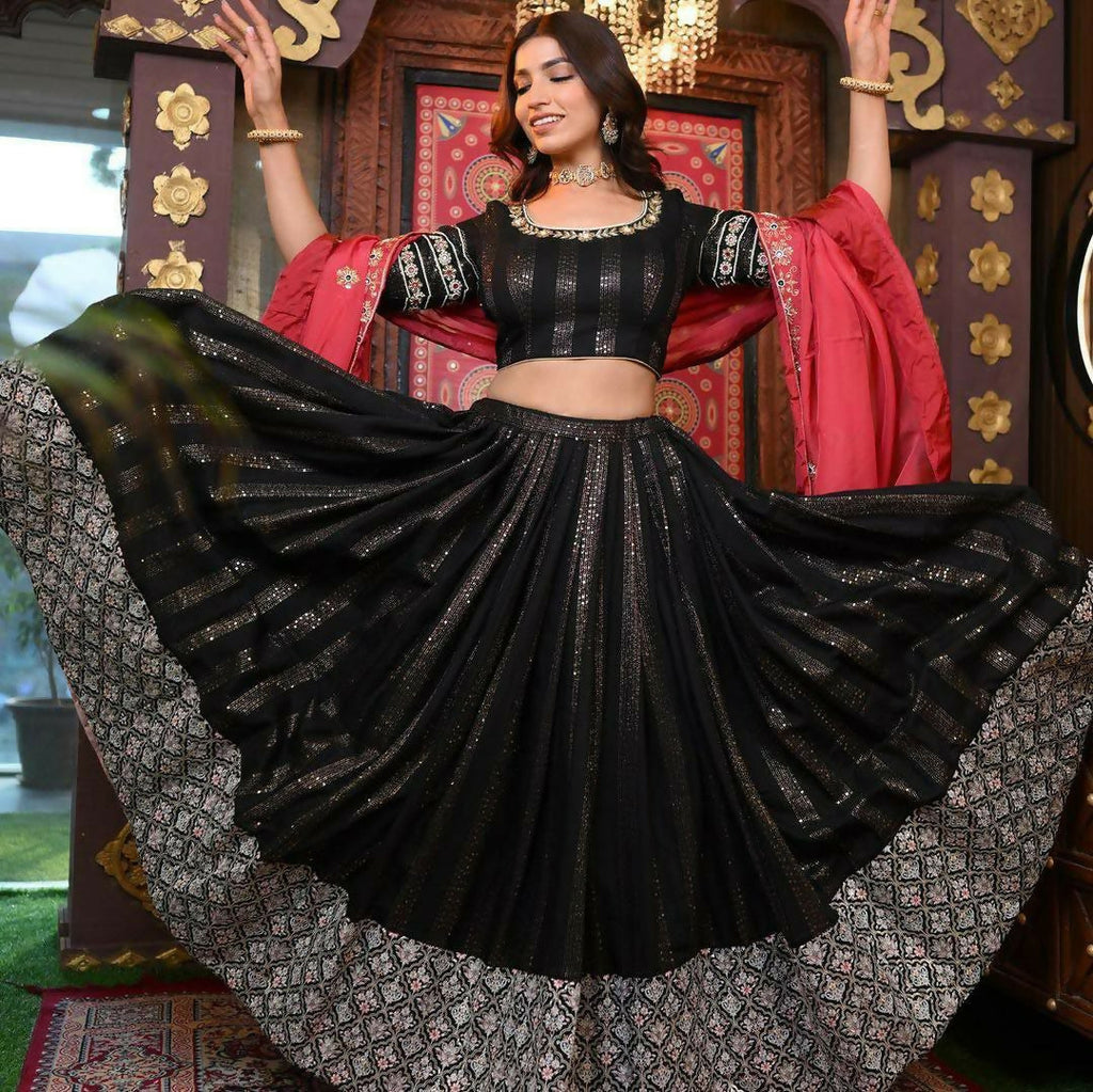 A stylish black faux georgette lehenga choli set decorated with shimmering 5MM sequins and traditional zari embroidery.