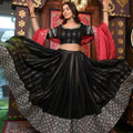 A stylish black faux georgette lehenga choli set decorated with shimmering 5MM sequins and traditional zari embroidery.