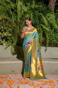 Firozi silk saree with gold Zari woven embellishments and matching blouse