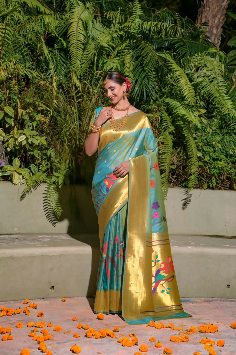 Firozi silk saree with gold Zari woven embellishments and matching blouse