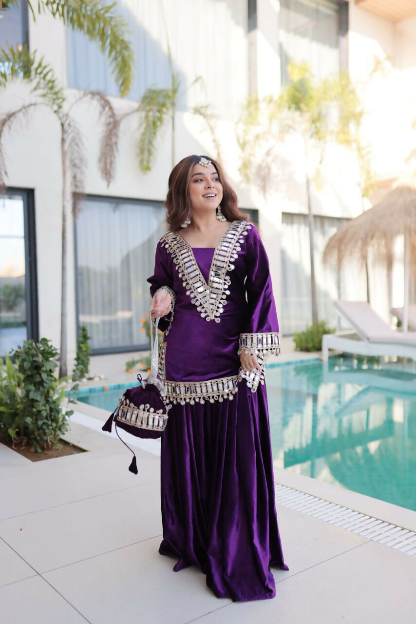 Purple velvet readymade kurta set with intricate embroidery and sequence work details.