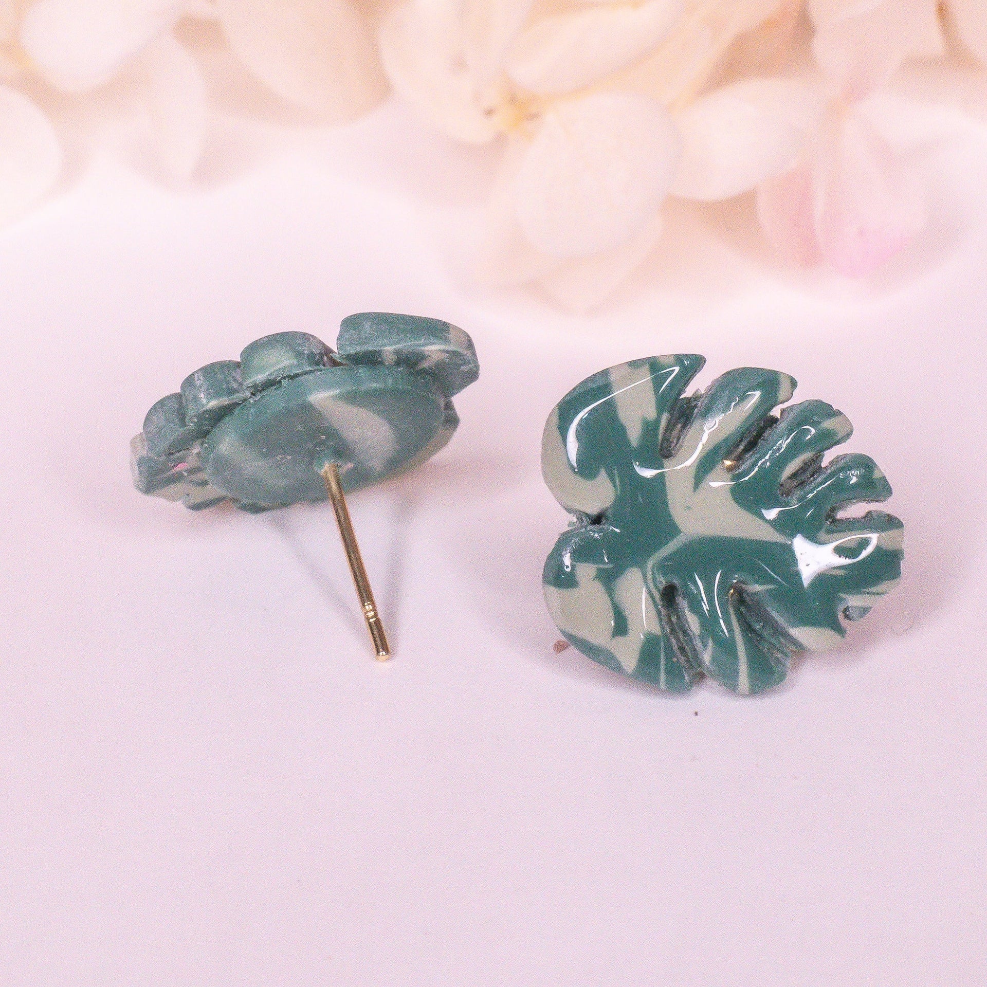 Handmade marbled teal and white Monstera leaf stud earrings