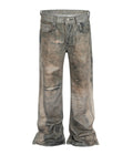 Front and back view of Undeveloped Wideboy Max unisex straight fit jeans in light wash with all-over dune print and distressed knees.