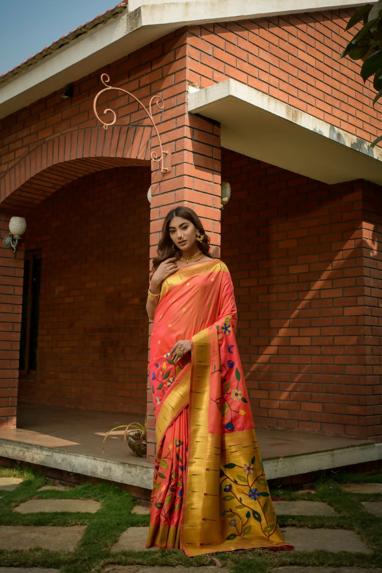 Vibrant coral Paithani silk saree with detailed Zari work and matching fabric blouse