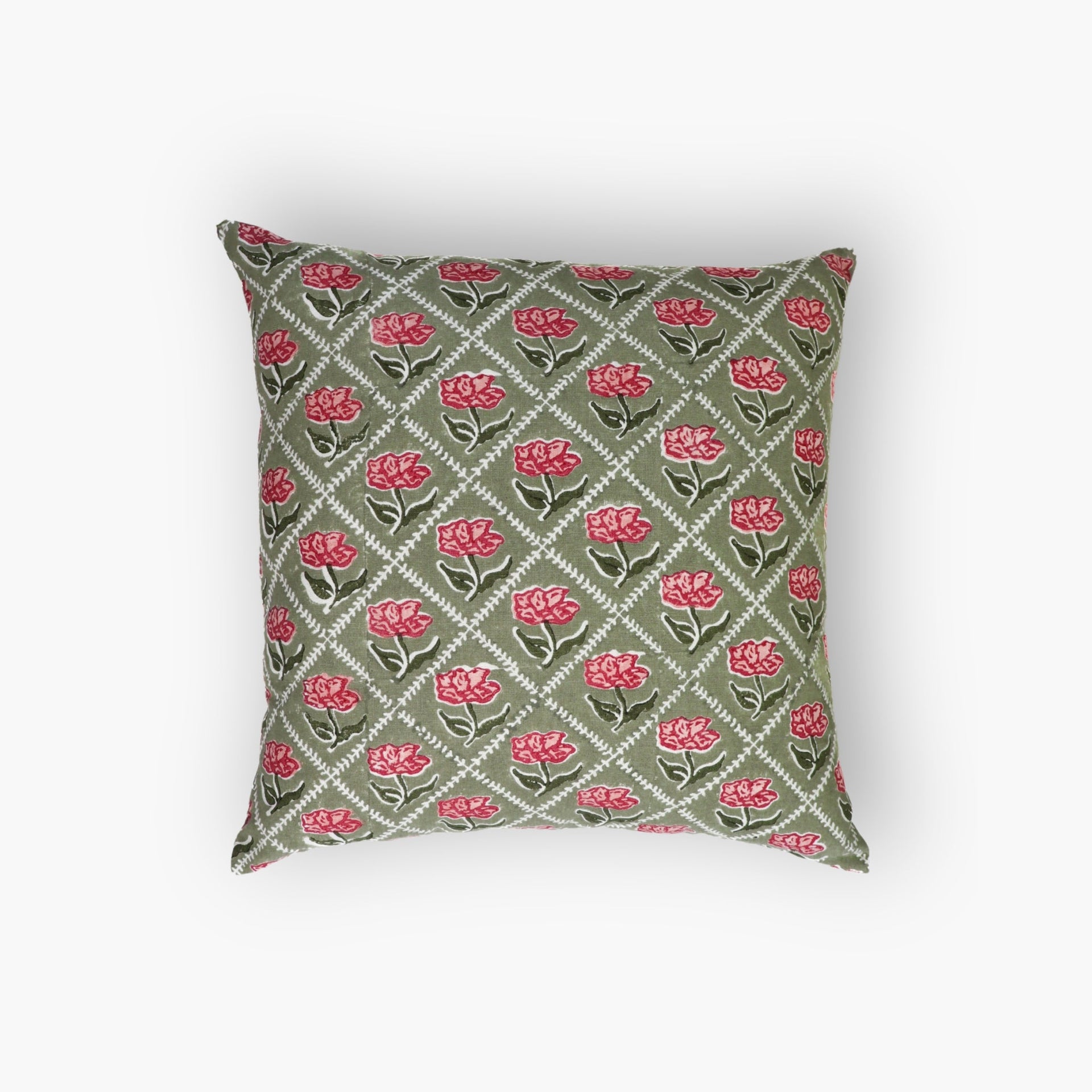 Hand-block printed olive green and pink floral linen throw pillow cover on a neutral sofa.