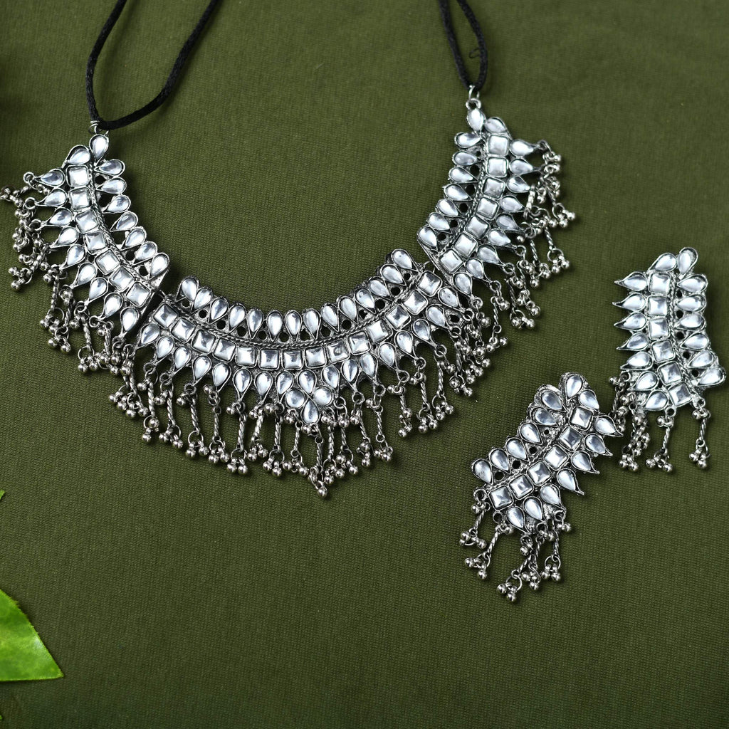 Detailed view of Kundan stone necklace on oxidised silver-plated brass