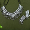 Detailed view of Kundan stone necklace on oxidised silver-plated brass