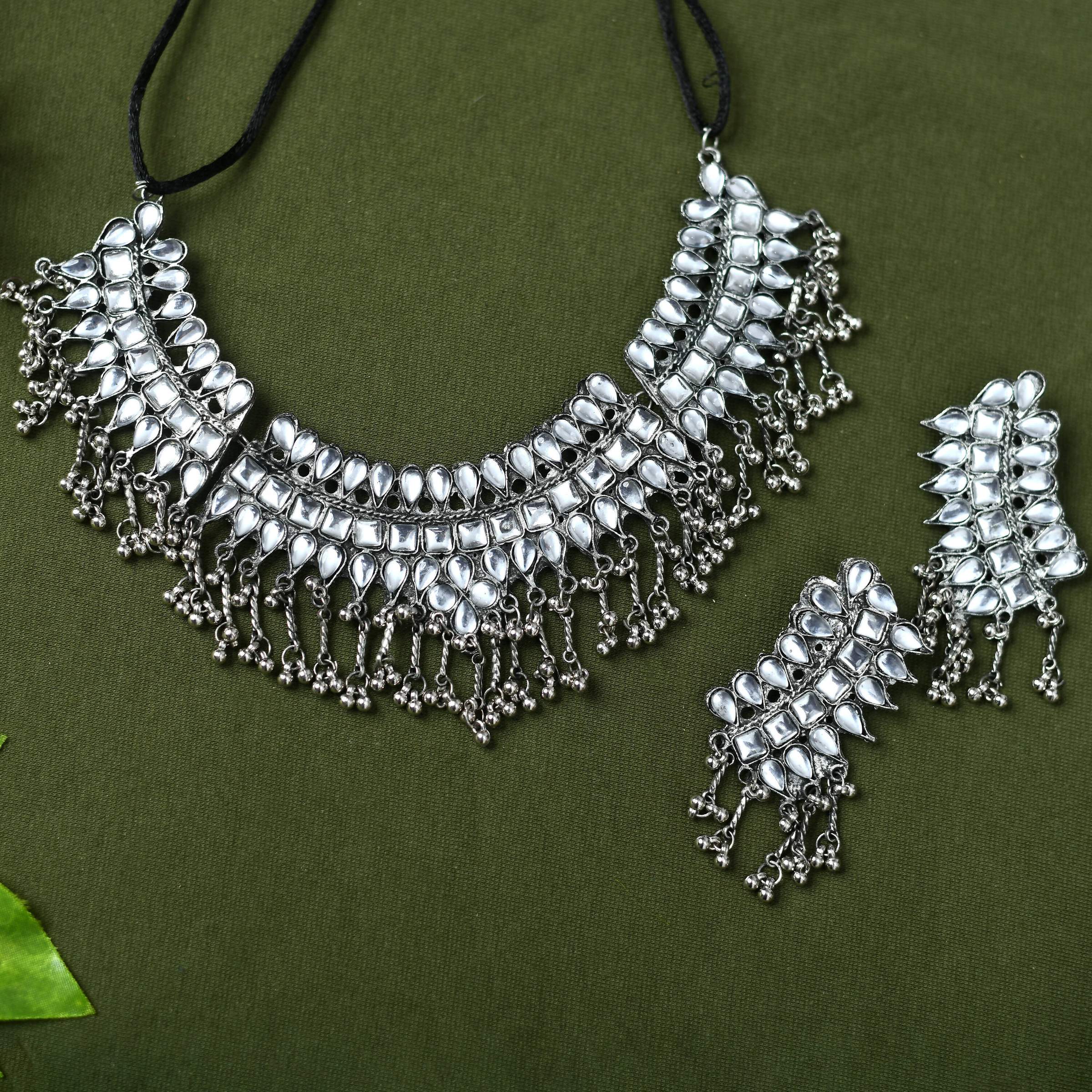 Detailed view of Kundan stone necklace on oxidised silver-plated brass