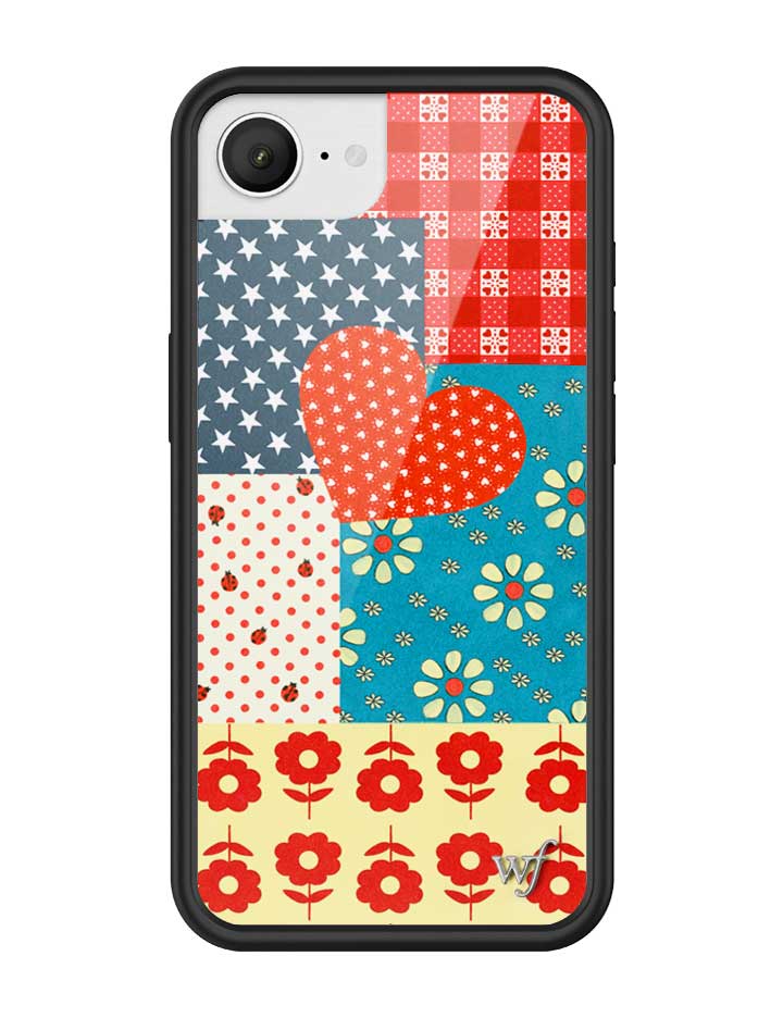 Flower Patch iPhone case featuring a patchwork design of cherry-check plaid, red ladybugs, retro florals, and a center heart