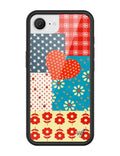Flower Patch iPhone case featuring a patchwork design of cherry-check plaid, red ladybugs, retro florals, and a center heart