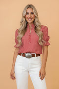 Red and white striped blouse with puff sleeves, gathered collar, and button front