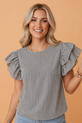 Woman wearing a black and white vertical striped cotton blouse with ruffle sleeves and a round neck.