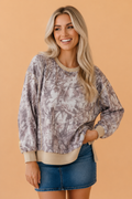 Camo print tunic sweatshirt with colorblock trim and side split detail.