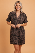 Model wearing a brown and black leopard print mini dress with a contrast polo collar and rolled short sleeves.