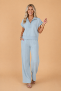 Half zip polo t-shirt paired with matching high waist knit pants in light blue and grey