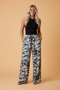 Close up of women's camouflage print high waist wide leg pants with drawstring
