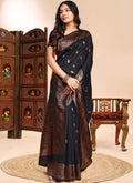 Stunning black lichi silk wedding saree with heavy embroidered border.