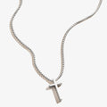 A dainty cross pendant necklace on an adjustable chain, available in sterling silver or 14k gold vermeil.