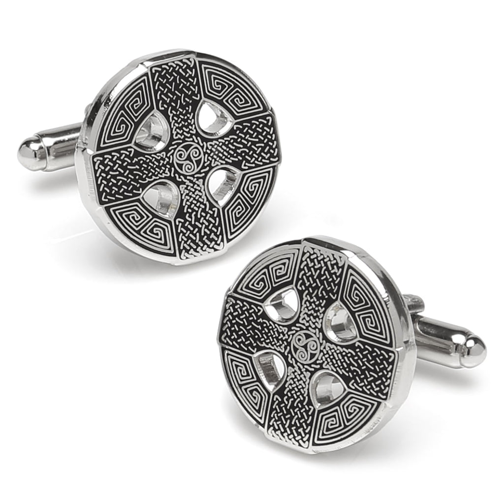 A pair of round silver Celtic cross cufflinks with intricate black etched knotwork details against a white background.