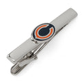 Silver-plated Chicago Bears NFL tie clip with team logo detail on a navy striped necktie
