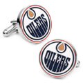 A pair of round silver tone cufflinks featuring the Edmonton Oilers hockey team logo in blue, orange, and white enamel.