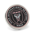 Close up of an official Inter Miami CF soccer team logo lapel pin in silver metal and black and pink enamel.