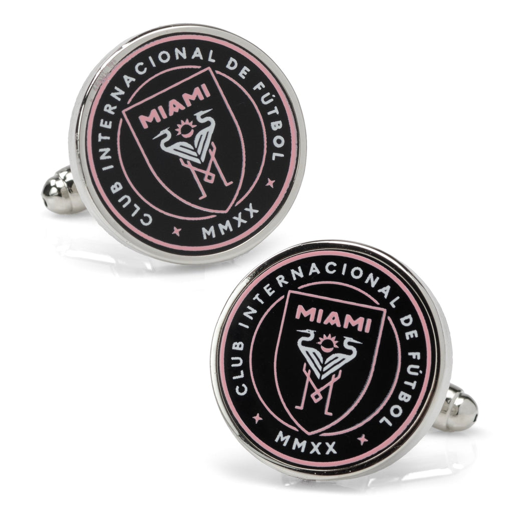 A pair of round Inter Miami CF logo cufflinks featuring a black and pink enamel design on silver plated metal.
