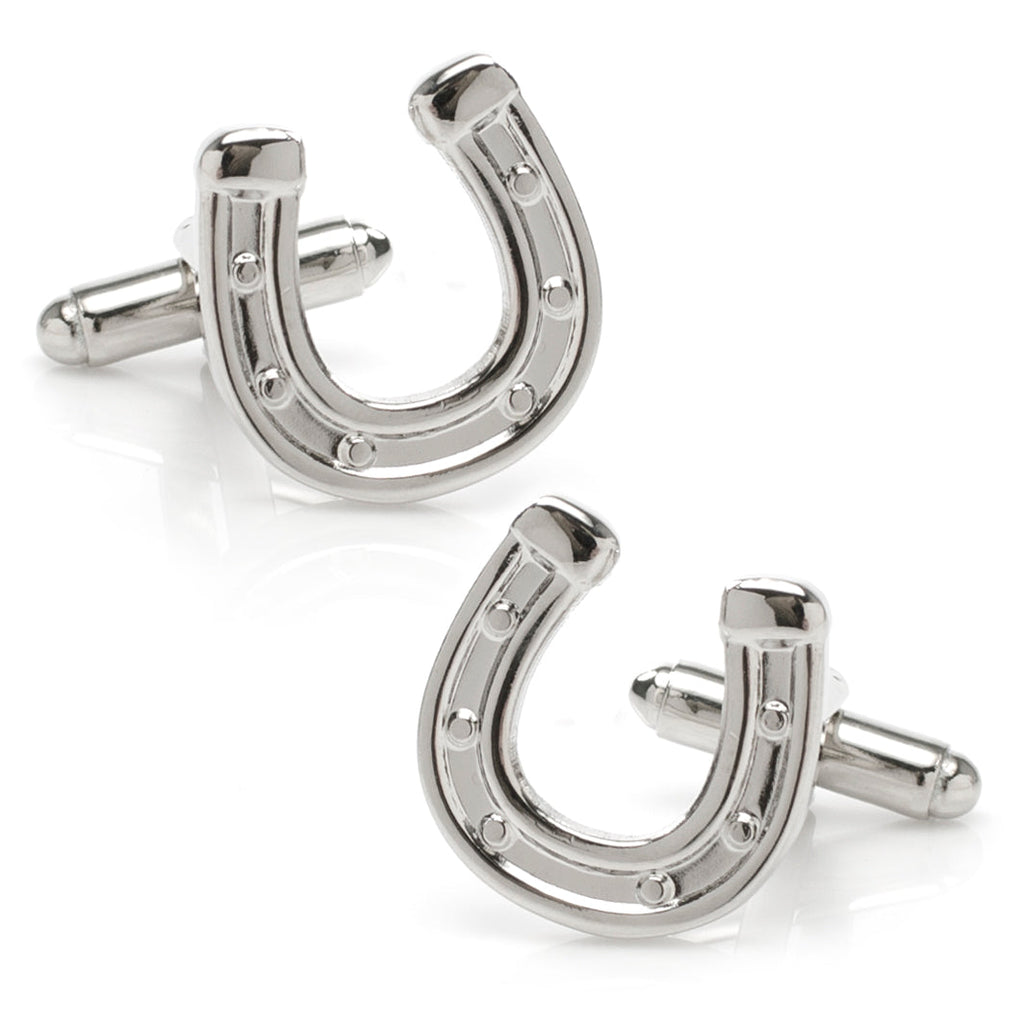 Silver tone horseshoe shaped cufflinks on a white background
