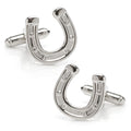 Silver tone horseshoe shaped cufflinks on a white background