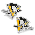 A pair of Pittsburgh Penguins hockey logo cufflinks with black, white, and gold enamel on silver-tone metal.