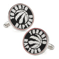 A pair of round Toronto Raptors basketball cufflinks with a silver tone finish and enamel team logo.
