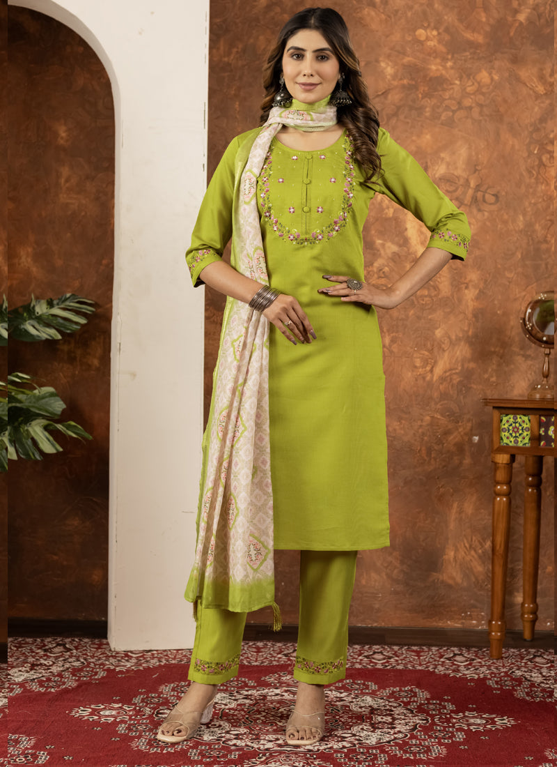 Woman wearing a Parrot Green Marina Silk kurta set with multi-thread embroidery.