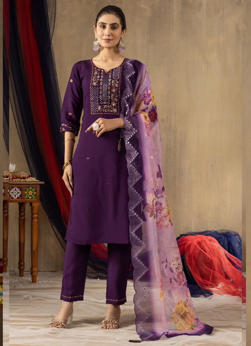 Close up of deep purple Roman silk fabric featuring elaborate multi-thread embroidery and handwork.